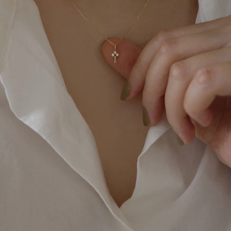 Gold necklace with key