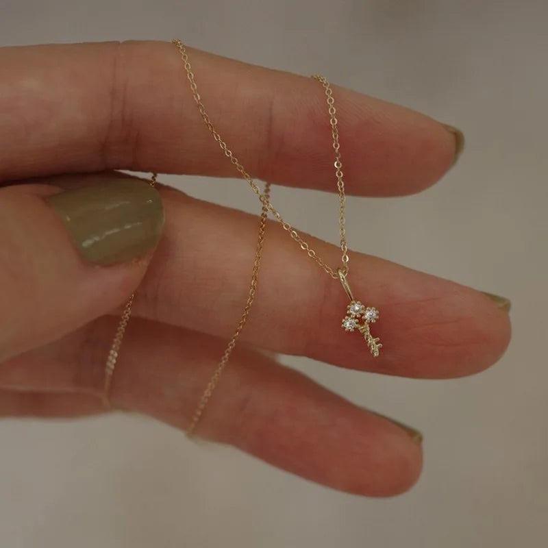 Gold necklace with key