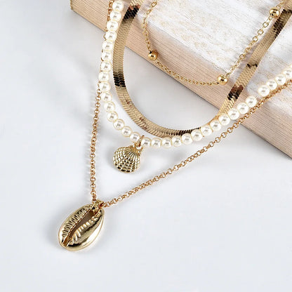 Gold seashell necklace