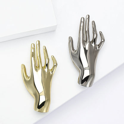 Brooch hand