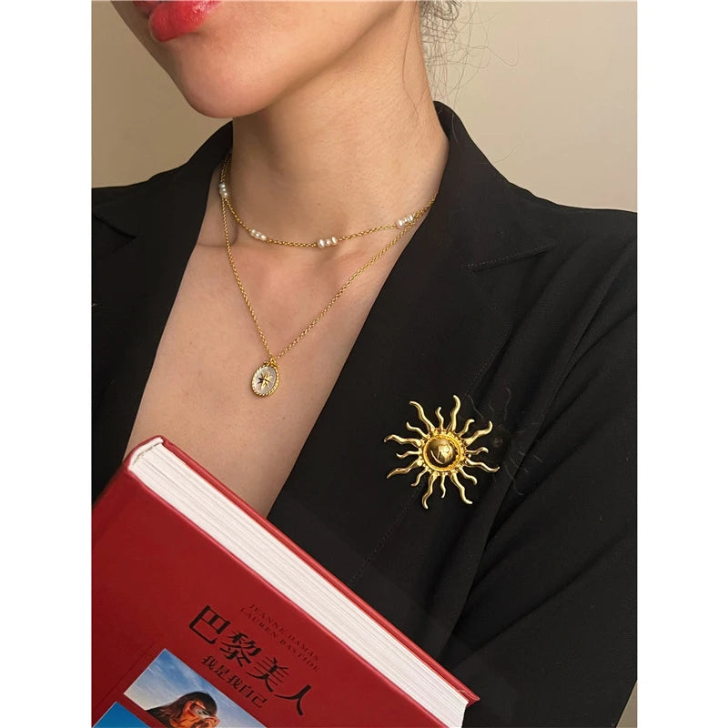 Sun brooch