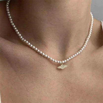 Pearl necklace with planet