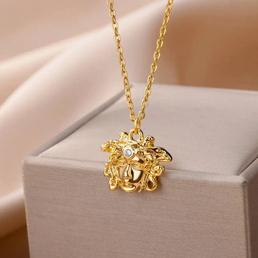 Gold medusa pendant